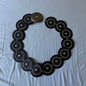Black and silver circle belt